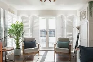 PLantation Shutters Northern Ireland Village Blinds and Shutters Shutters in New Build living space with plantation shutters open showing patio doors Village Blinds and Shutters Northern Ireland