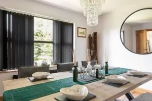 dining area with black vertical blinds