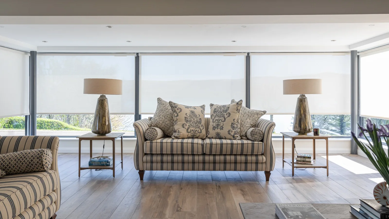 Made-to-measure Roller blinds fitted across wide living-room glazing in Northern Ireland