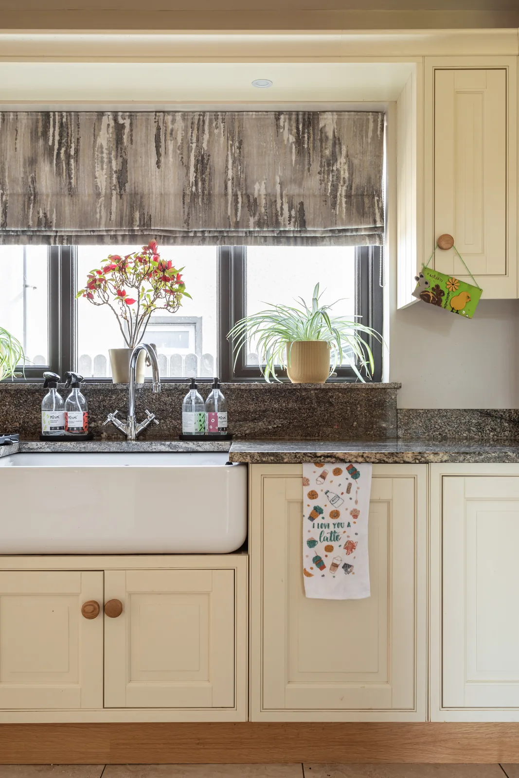 Patterned Roman blind fitted above a kitchen window