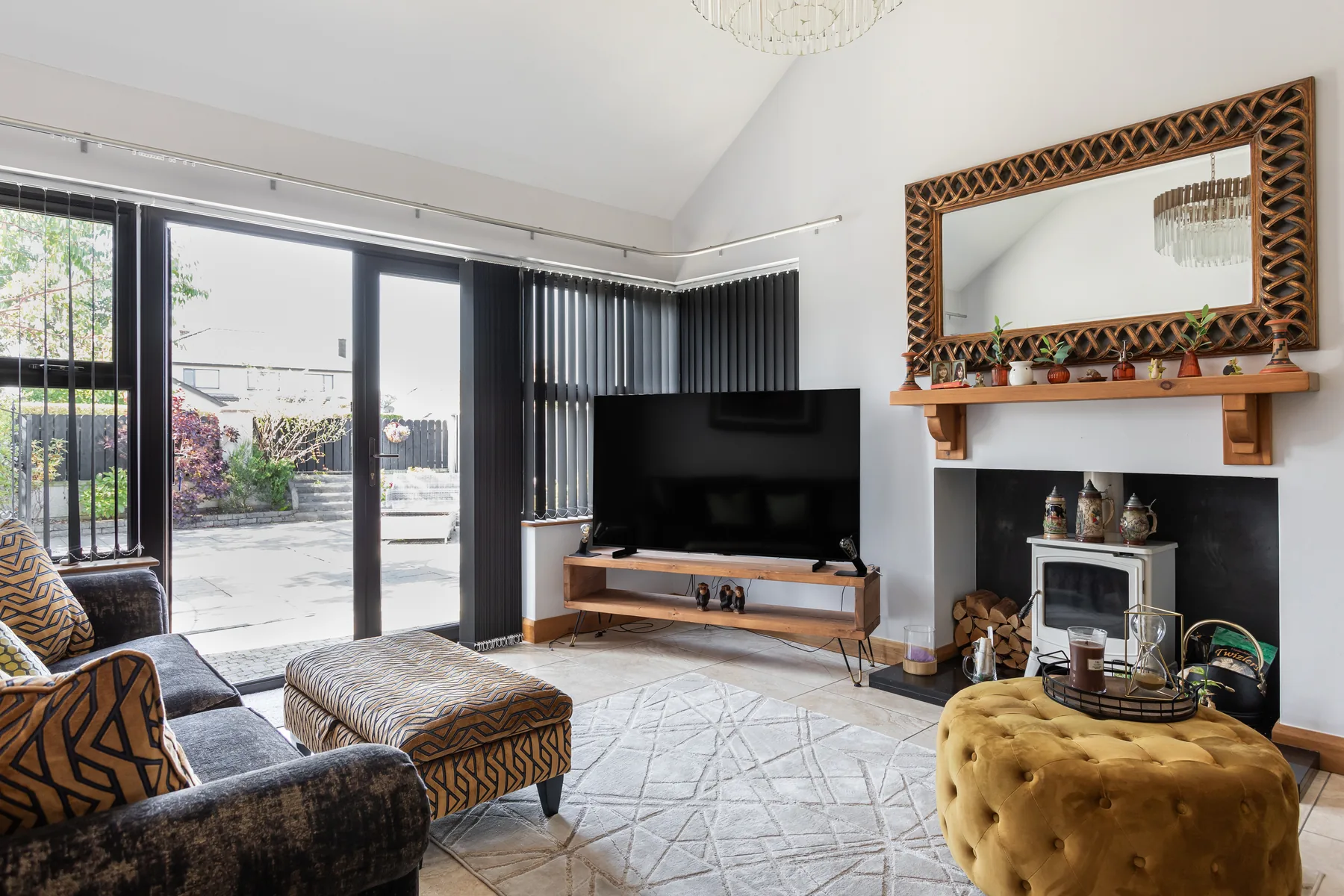 Vertical blinds fitted across patio doors and living-room windows