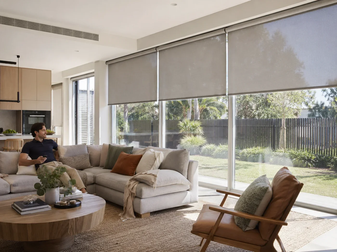 Bright open-plan room with motorised blinds managing strong daylight