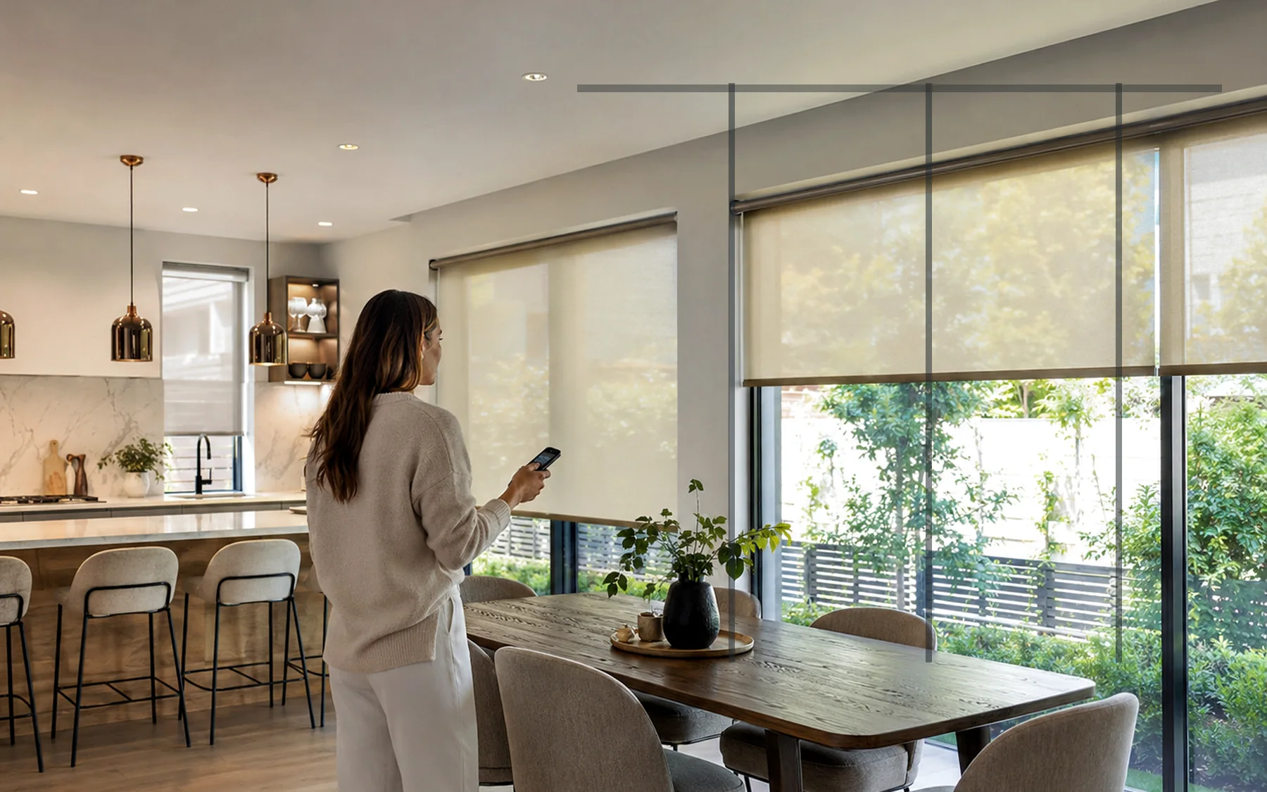 Open-plan kitchen and living room with motorised blinds across a wide multi-panel glazed opening
