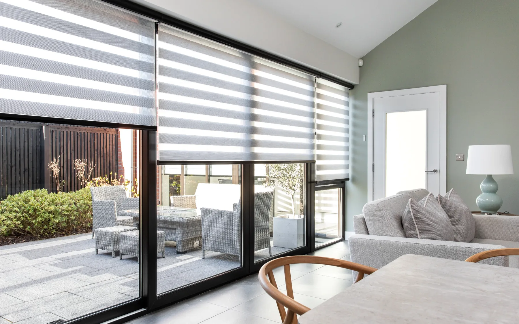 Motorised Day and Night blinds across wide glazed doors in a contemporary Northern Ireland home