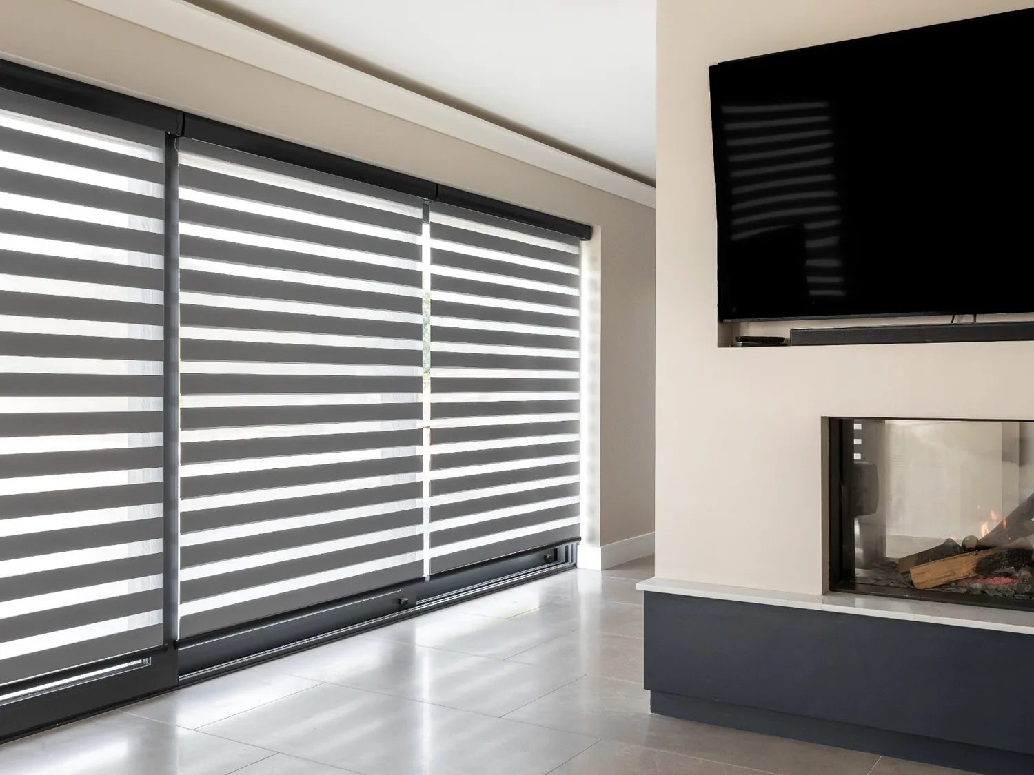 Day and Night blinds fitted across a large modern living-room window