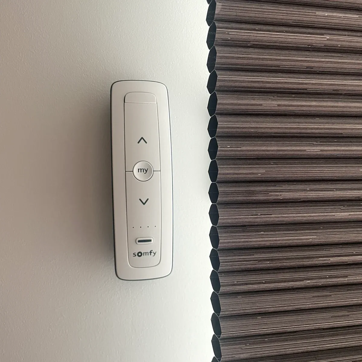 Motorised cellular blind with Somfy wall control