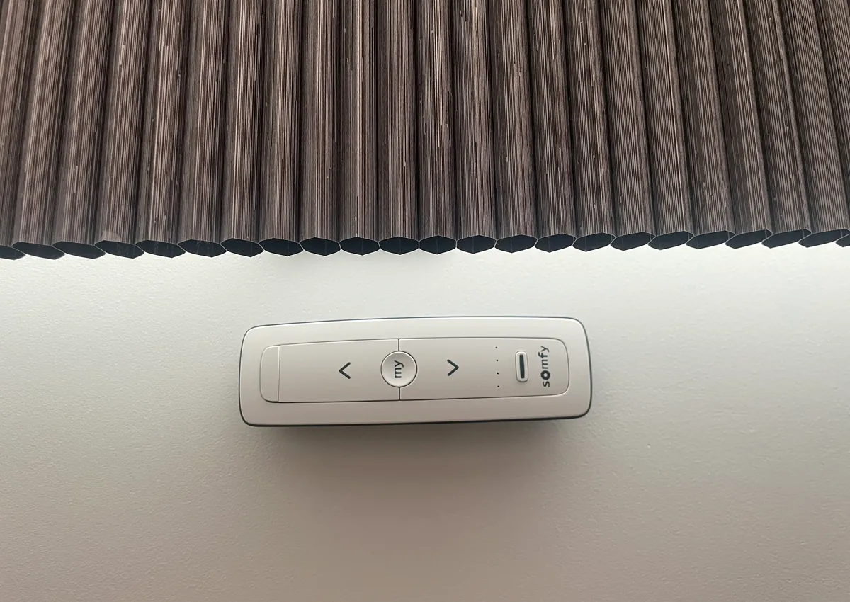 Somfy control fitted beside a motorised Roman blind