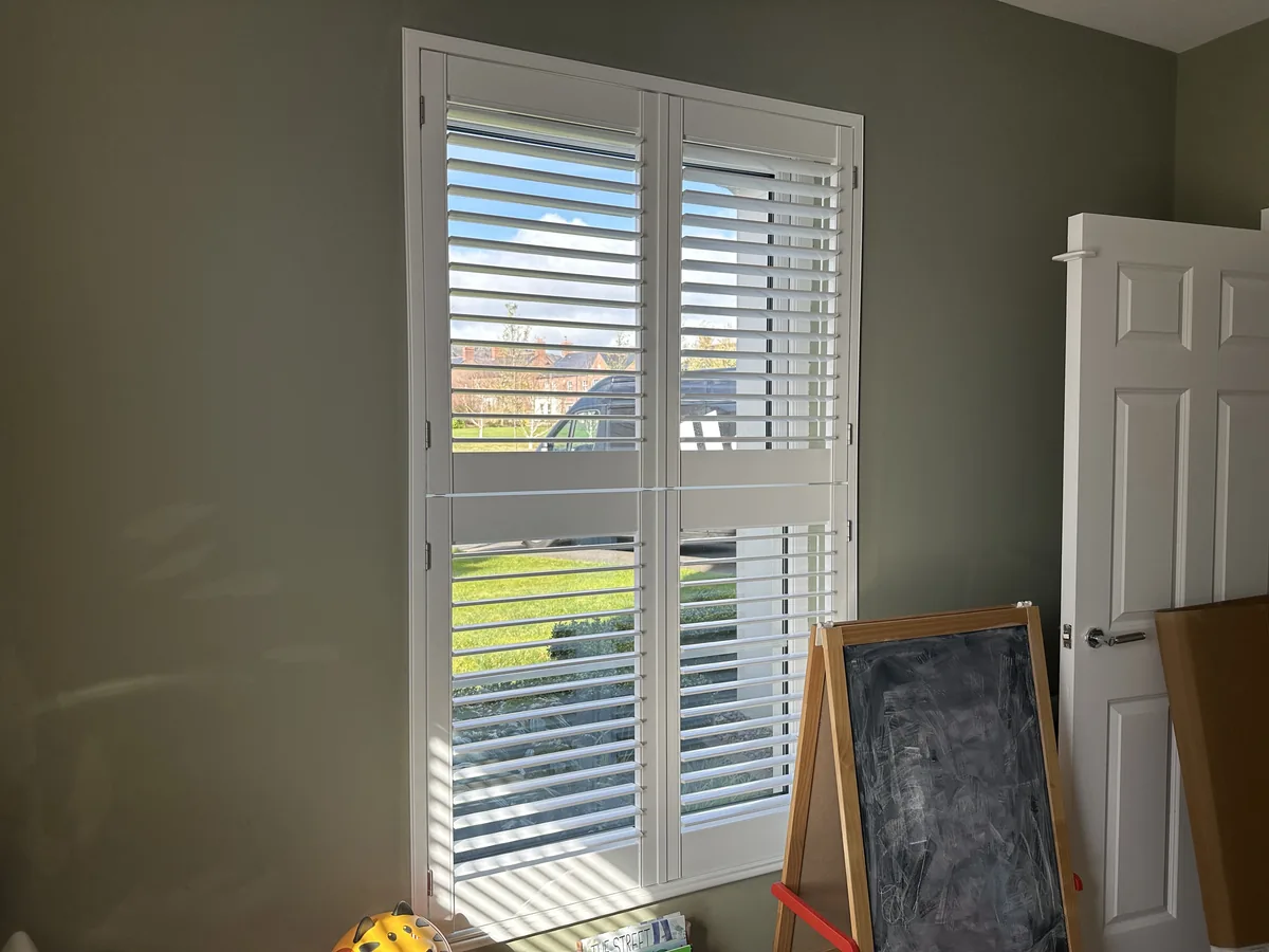 Tall window showing the horizontal split between upper and lower Tier-on-Tier shutter sections