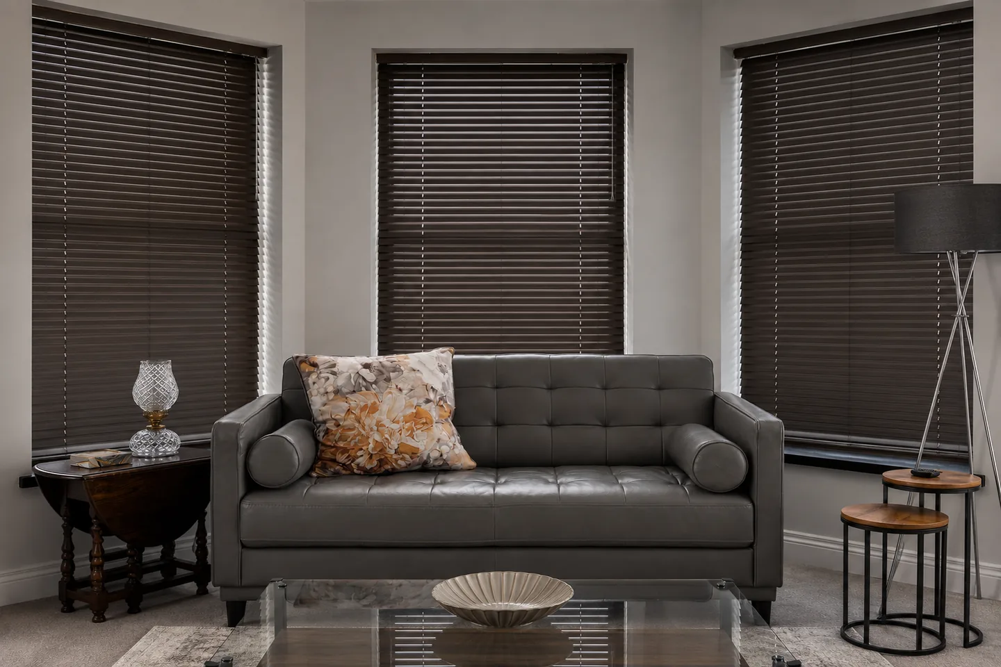Illustrative living room with dark Venetian blind slats turned nearly closed for stronger daytime privacy