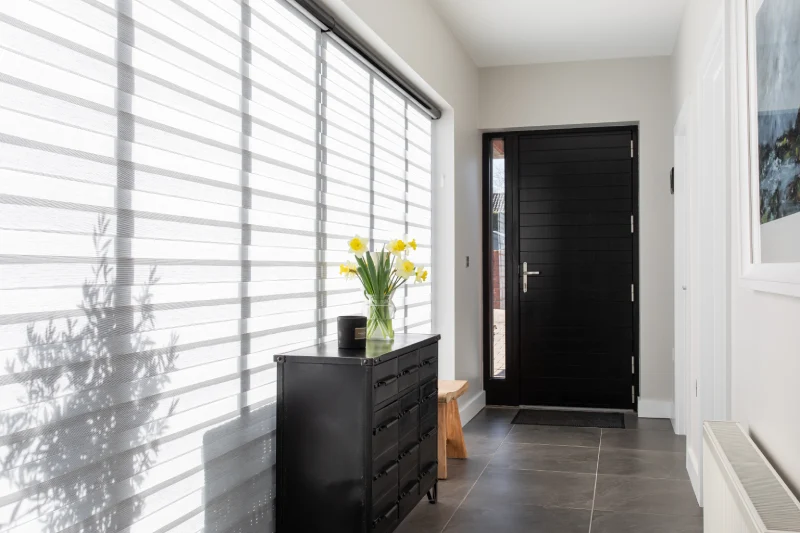 Hallway window with made-to-measure window covering fitted by Village Blinds and Shutters