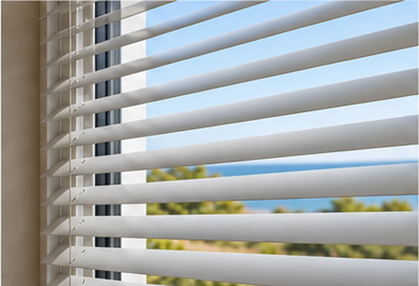 Slim aluminium Venetian blinds fitted to a static caravan window with the slats angled for privacy