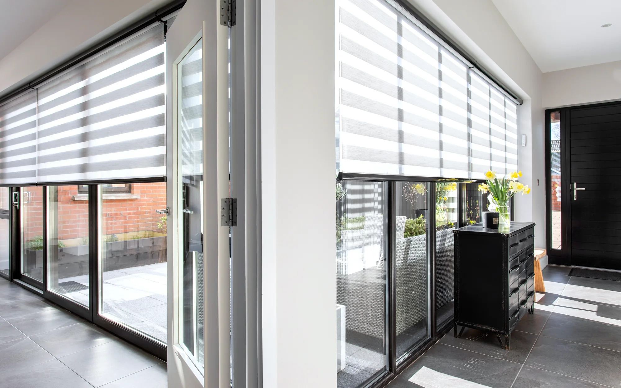 Motorised Day and Night blinds fitted across large glazed doors in a Northern Ireland home